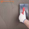 Adhesive being laid